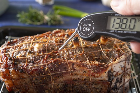 Checking temperature of a roast